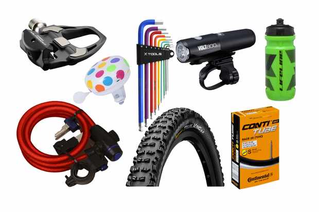 Collage of a range of cycling accessories on a white background, including a pedal, light, colourful Allen key set, bell, lock, tyre, inner tube in a box and a light