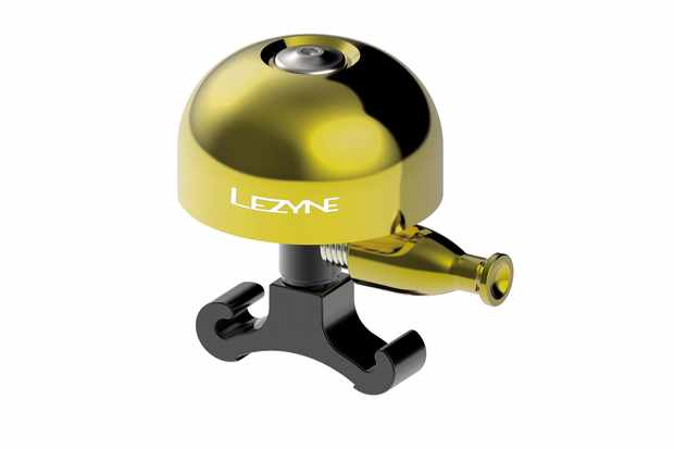Image of a yellow Lezyne bicycle bell on a white background