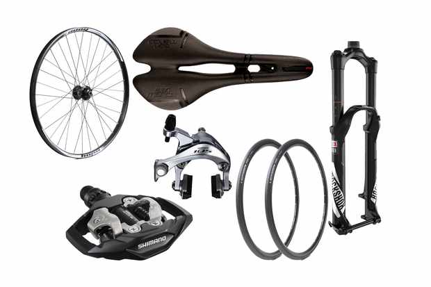 Collage of a bike wheel, saddle, pedal, tyres, suspension fork and silver brake callipers