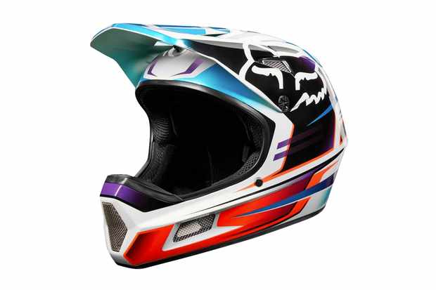 A colourfull full-face mountain bike helmet on a white background