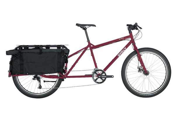 Dark red Surly Big Dummy bicycle with a load-carrying rack on the back, on a white background
